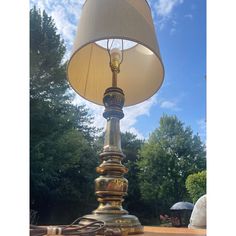 a lamp sitting on top of a wooden table