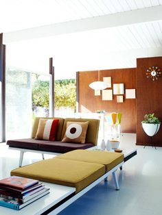 a living room filled with lots of furniture and decor on top of a white table