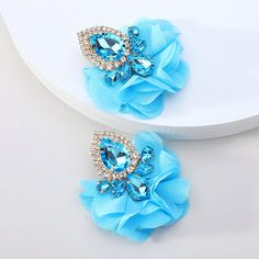 These exquisitely crafted Floral Lace Full Crystal Rhinestone Maxi Stud Dangle Earrings feature a vibrant color palette and intricate floral lace accents. The colorful crystals add depth and texture, making these earrings perfect for any occasion. Available in 7 different colors. Details Item Type: Fashion Earrings Metal Type: Zinc Alloy Material: Acrylic,Chiffon Size: 5.5*4.9cm Back Finding: Push Back Areca Nut, Big Dangle Earrings, Popular Earrings, Embellished Fashion, Vintage Fine Jewelry, Choker Pendant, Wedding Party Jewelry, Lace Flower, Fashion Jewelry Earrings