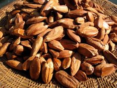 some nuts are sitting in a wicker basket