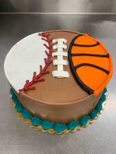 a birthday cake decorated with a basketball and ball on it's side is ready to be eaten