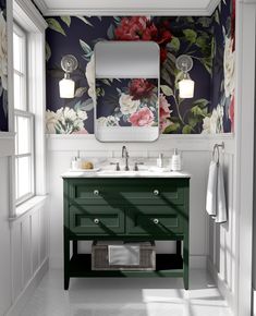 a bathroom with floral wallpaper and green vanity