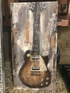 a painting of an electric guitar on a kitchen counter