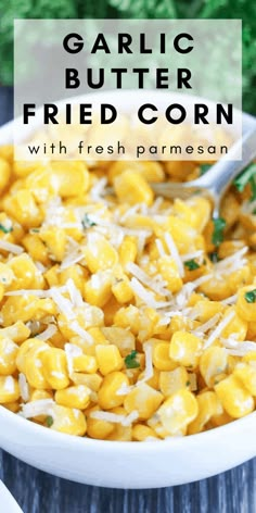 garlic butter fried corn with fresh parmesan in a white bowl on a wooden table