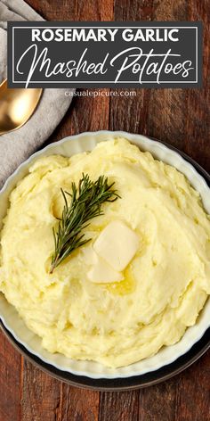 a bowl filled with mashed potatoes on top of a wooden table