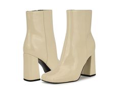 Nine West Spice - Women's Boots : Cream Patent : The Nine West Spice heels look stylish in appeal and effortlessly elevate your fashion statment. These come with a glossy leather upper, textile or man-made lining, and comfortable footbed. The heels are exquisitely crafted with a modern squared toe shape, side zipper closure for easy adjustability, and a high block heel. Ankle-length silhouette. Synthetic outsole. Imported. Measurements: Heel Height: 3 3 13 in Weight: 1 lb Circumference: 10 1 4 i Trendy Patent Leather Heeled Boots Medium Width, Spring Chic Patent Leather Heeled Boots, Chic Patent Leather Heeled Boots For Spring, Cream Boots For Office In Fall, Spring Patent Leather Heeled Boots Medium Width, Modern Cream Boots For Formal Occasions, Fall Patent Leather Boots With Padded Heel, Spring Patent Leather Heeled Boots With Reinforced Heel, Chic Patent Leather Heeled Boots With Padded Heel