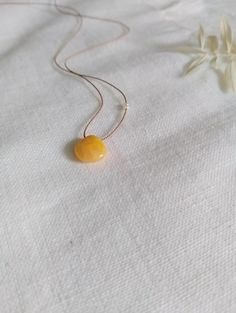 Minimalist Gemstone Necklace Natural silk, adjustable up to 25" Yellow tone heart shaped natural gemstones knotted on silk, dainty style. Can send photos upon request of choice of stone. Option to add pearls. Beautiful bohemian style necklace, perfect as a gift. Adjustable Yellow Lariat Jewelry, Adjustable Yellow Lariat Necklace, Handmade Yellow Baltic Amber Necklaces, Handmade Baltic Amber Necklace In Yellow, Handmade Yellow Baltic Amber Necklace, Minimalist Necklace With Adjustable Natural Stones, Handmade Adjustable Amber Necklaces, Handmade Amber Necklace With Adjustable Fit, Handmade Adjustable Baltic Amber Jewelry