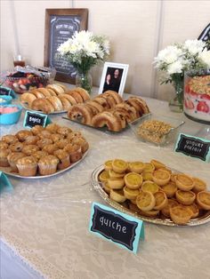 a table topped with lots of pastries and desserts