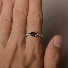 This is a gorgeous handmade creation. Its beauty is its simplicity & Elegance. The 5*7 mm oval shape faceted natural garnet is crafted in solid sterling silver and with rhodium plated. All item is sent in a beautiful gift box If you have any idea of design your ring,pls contact me directly. You can realize more lovely stuff clicking the link https://www.etsy.com/shop/knightjewelry?refshopsection_shophome_leftnav Please leave the correct address and you phone number for delivering successfull Garnet Gemstone Accents Promise Ring, Garnet Gemstone Promise Ring, Garnet Ruby Ring With Gemstone Accents For Promise, Garnet Gemstone Ring In Marquise Cut, Oval Garnet Ruby Ring As Gift, Marquise Cut Garnet Gemstone Ring, Ruby Ring With Garnet And Gemstone Accents For Anniversary, Oval Cabochon Garnet Rings For Anniversary, Oval Garnet Rings For Anniversary