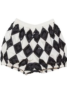 a black and white checkered shorts with sequins on the bottom is shown