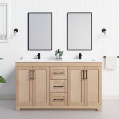 two mirrors are above the double sink vanity in this white bathroom with wood cabinetry and tile flooring