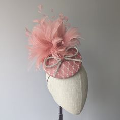 "YOUR CUSTOM COLORS - MADE TO ORDER ☀ Follow this link for more beautiful choices from 'Indigo Hats'  https://www.etsy.com/shop/IndigoHats ☀ You know when things just come together perfectly? - that's how I feel about this hat. I made this fabulous percher shape (higher in the back than the front) in a lovely blush pink color sinamay straw  - the percher style sits quite far forward, you will look very glam in this one.  Along with some gorgeous matching fluffy feathers, this fascinator features Luxury Pink Fascinator With Pinched Crown, Pink Party Hat With Feathers, Pink Feathered Fascinator For Evening, Adjustable Pink Feathered Fascinator, Pink Adjustable Fascinator With Feathers, Adjustable Pink Fascinator With Feathers, Adjustable Pink Feather Fascinator, Pink Feather Fascinator For Royal Ascot, Pink Hats With Feather Trim And Adjustable Fit