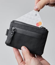 Stow your cards and cash quickly in our smallest pouch. Designed for those who want to carry as little weight as possible, the Zip Pouch has secure storage space for frequently used items such as credit cards and bank notes. With an extra pouch for coins or smaller items like your spare SIM card, you'll find room even for business cards too! 130mm x 85mm 4-12 cards X-Pac™ VX21 Black fabric Produced in limited runs Orange ripstop nylon interior fabric Weatherproof fabrics Compatible with HUB Keyc Leatherman Wave, Edc Wallet, Neutral Fabric, Man Bags, Golf Brands, Mini Pouches, Carbon Neutral, Small Pouches, Interior Fabric