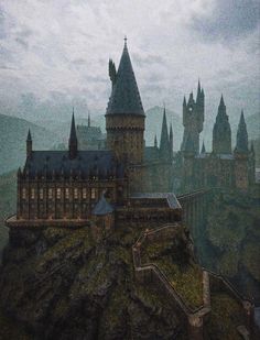 the hogwarts castle is perched on top of a rock outcropping