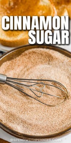 cinnamon sugar in a bowl with a whisk on top and toasted bread behind it