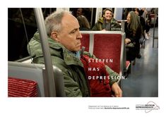 a man sitting on a train looking out the window with his hand in his pocket