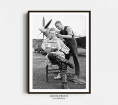 an old photo of a man getting his hair cut by another man sitting in a chair