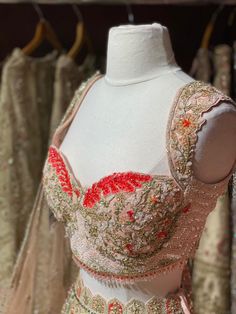 Light pink intricate with fully sequence, studs motifs thread embroidery and crystal stone work lehenga embellished with beautiful outline in red sequins paired with sweetheart neckline blouse and net dupatta. Fabric Net Custom designed according to client measurements and color preference. Production and delivery time is 90days! Wedding Party Wear Blouse With Intricate Embroidery, Embellished Red Blouse Piece For Designer Wear, Bollywood Style Embellished Choli For Reception, Embellished Party Wear Blouse For Wedding, Embellished Blouse Piece For Wedding Party, Embellished Wedding Blouse Piece For Party Wear, Pink Hand Embellished Lehenga For Festivals, Red Embellished Party Wear Sharara, Red Embellished Sharara For Party Wear