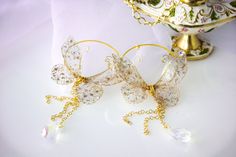 Delicate Gold Hoop Earrings For Party, White Pierced Chandelier Earrings For Party, Elegant Dangle Resin Earrings, Elegant Resin Dangle Earrings, Elegant Clear Hoop Earrings For Party, Elegant Clear Resin Earrings, Elegant Wedding Earrings Made Of Resin, Whimsical Resin Jewelry For Party, Handmade Clear Earrings For Wedding