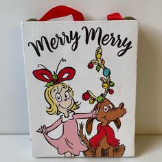 a christmas bag with a cartoon girl and horse on the front that says, merry