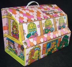 this is an image of a toy house made out of wrapping paper on black background