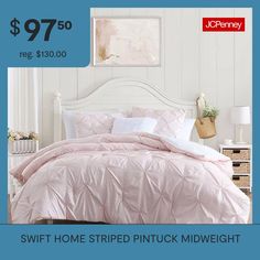 a bed with pink comforter and pillows on it for $ 79 95 reg $ 130 00