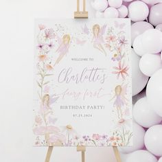 a welcome sign is surrounded by balloons and streamers in pastel colors, as well as a fairy theme