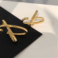 A modern way of wearing ear cuff. Irregular shape and of larger size, gorgeous piece of statement earrings. No piercing required. To dress, simply tuck in at the top of your ear and slide down. Sold as a PAIR. • S P E C I F I C A T I O N • Finish: 18K PVD gold / silver Dimension: approx. 4.1 cm x 2.4 cm Trendy Gold Ear Cuff With Matching Earrings, Chic Metal Ear Cuff, Modern Gold Ear Cuff For Party, Trendy Gold Pierced Ear Cuff, Trendy Gold Single Ear Cuff, Trendy Metal Ear Cuff With Matching Earrings, Elegant Metal Ear Cuff, Gold Minimalist Ear Cuff For Party, Trendy Metal Wrap Earrings