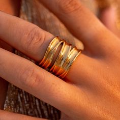 The Terra Wrap Ring winds gracefully around your finger, mirroring the contours of the earth itself. Inspired by earth's organic textures, the intricate wrap design symbolizes the interwoven roots of life, reminding you of the profound connection we share with the land. 18K Gold-Plated Stainless Steel Nickel-Free Lead-Free Hypoallergenic Water Resistant Gold Wrap Ring, Chocolate Wrapping, Organic Textures, Wrap Ring, Wrap Rings, Of The Earth, The Land, The Earth, Gold Jewelry