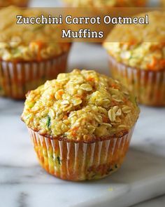 zucchini carrot oatmeal muffins on a marble counter