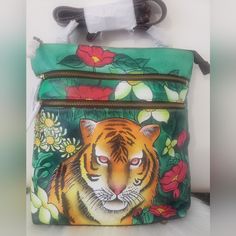 This Is A Rare Gorgeous Artistic Handpainted Lion With Flowers Panting, Lots Of Pockets And No Call Out . Comes With Dust Bag And Its Plastic. Hand Painted Crossbody Travel Bag, Hand Painted Crossbody Bags For Travel, Artistic Hand Painted Satchel Bag, Hand Painted Green Rectangular Shoulder Bag, Green Hand Painted Rectangular Shoulder Bag, Artistic Hand Painted Crossbody Shoulder Bag, Artistic Hand Painted Shoulder Bag, Green Hand Painted Tote Bag, Hand Painted Green Bags For Everyday