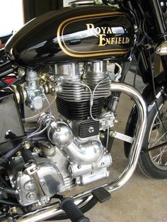 a black and gold motorcycle parked in a garage