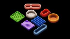 an assortment of plastic objects on a black background