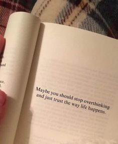 a person holding an open book in their hand with the words maybe you should stop over thinking and just trust the way life happens