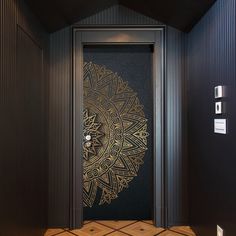 an ornate door in the corner of a room with tile flooring and black walls