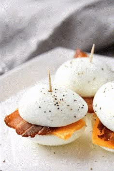 bacon and eggs are topped with melted cheese on toasted buns for an easy appetizer