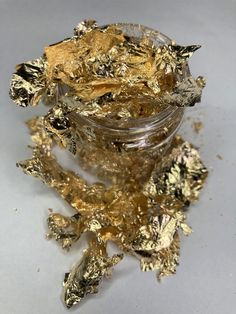 Metallic Foil is awesome for texturing items. Works on tumbler, nails, resin, painting and more. Volume may vary due to random shape of foil. Comes in a 1 oz bottle Solvent Resistant: Not Resistant to Acid or Alkali Non-edible gold leaf flakes. Do not use in food or drinks Gold Flake, Gold Flakes Makeup Looks, Gold Flake Resin, Candle With Gold Flakes, Resin Gold Flakes, Gold Foil Texture Backgrounds, Golden Birthday Parties, Edible Gold Leaf, Gold Spray