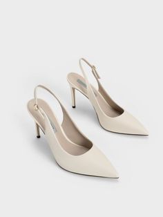 For classic pumps with an all-year appeal, these stilettos pumps in chalk-white are your best bet. Featuring the iconic stiletto silhouette and elegant pointed-toe, look put-together and polished the moment you slip these beauties on. The impressive 9.5cm heel lends any frame an instant style and height boost, while the adjustable slingback strap allows you to find your perfect fit. Pair them with palazzo pants and a tailored blouse for a chic, work-ready look. Charles And Keith Wedding Shoes, Shoes For Women Aesthetic Heels, Wedding Shoes Classy, Size 4 Heels, Stiletto Shoes Heels, White Dainty Heels, Classic Pumps Heels, Classic White Heels, White Pointed Toe Heels