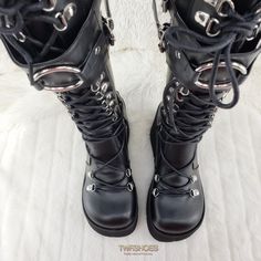 KERA-2004 1/2" PFSize: 6-114 1/2" (114mm) Platform D-Ring Lace-Up Knee High Boots Featuring Adjustable Shield w/ an Oversized O-Ring, Full Length Back Metal Zip Closure ******Please note****** Due to High Volume Sales Pleaser/ Demonia has stopped all Direct Shipping Orders may take up to 6 weeks to arrive as we have to order them in to ship to you Shop Our collection of Pleaser In House for FAST Shipping!! contact us with any questions or concerns before ordering or if your size is not listed it Black Lace-up Combat Boots With Rivets, Black Lace-up Boots For Cosplay, Black Lace-up Alternative Combat Boots, Black Lace-up Combat Boots Alternative Style, Black Lace-up Combat Boots In Alternative Style, Alternative Style Black Boots With Round Toe, Black Round Toe Alternative Boots, Black Fitted Edgy Combat Boots, Black Gothic Boots For Cosplay