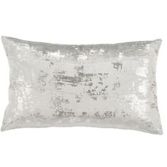 a white pillow with silver sequins on the front and back, sitting on a white background