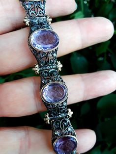 Absolutely Stunning Georgian/ Victorian Silver18k Gold Rose cut Diamond, Amethyst intaglio Link Bracelet.. safety chain on the side. Very good Antique pre Owned Condition, only 3 small diamonds are missing, not showing when u wear it. Selling AI Is. all sales are final no return Some pics ENLARGED to see details . Weight 25.45 Grams.. Museum Quality ONE OF A KIND.. There is 6 Amethyst intaglio..15mm wide. SUPER RARE.. Luxury Yellow Gold Amethyst Bracelets, Luxury Round Amethyst Bracelets, Luxury Gold Amethyst Bracelets, Luxury Amethyst Bracelets For Formal Occasions, Victorian Gemstone Bracelets As Gift, Formal Purple Fine Jewelry Bracelet, Elegant Amethyst Bracelet, Antique Gemstone Bracelets For Formal Occasions, Antique Purple Bracelets For Formal Occasions