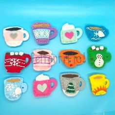 small felt tea cups and mugs on a blue background