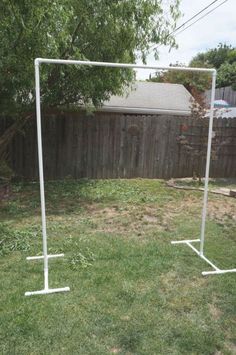 an empty soccer goal stands in the yard