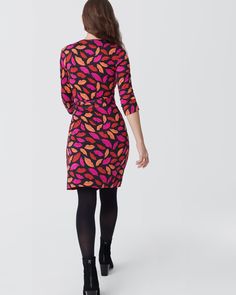 Cut from our signature silk jersey, this knee-length wrap dress has long sleeves, a V-neck collar, and true wrap closure. The fabric is a perfect weight and doesn't wrinkle, making it the ultimate year-round travel companion. Fitted Wrap Dress With 3/4 Sleeves, Luxury Fitted V-neck Wrap Dress, Floral Print V-neck Wrap Dress For Day Out, Chic Rayon Wrap Dress With V-neck, Chic V-neck Rayon Wrap Dress, Midnight Kisses, Luxury Floral Print V-neck Wrap Dress, Jersey Wrap Dress, Round Trip