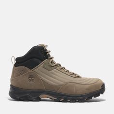 the men's hiking shoe is shown in tan, black and grey colors with an upper