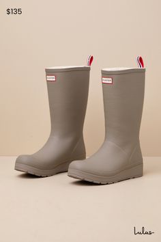 A practical cutie like you won't be winter-ready without the Hunter Play Tall Medium Natural Shearling Mid-Calf Rain Boots! These matte rubber rain boots feature a rounded upper that rises to a 10.5"" mid-calf shaft with a 15.75"" circumference. Soft, faux shearling lining throughout adds some extra comfort to the slip-on design, made easy by the signature striped pull tab at the back. A sturdy flatform sole completes the splash-worthy look! Available in whole sizes only. Logo tag at the front. 1. 25" rubber heel. Cushioned insole. Rubber sole has nonskid markings. Man Made Materials. Imported. Lulus | Play Tall Medium Natural Shearling Mid-Calf Rain High Heel Boots. The Hunter, Logo Tag, Heel Boots, Rubber Heels, High Heel Boots, Pull Tab, Mid Calf, Rubber Rain Boots, Rain Boots