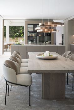 a dining room table with chairs around it