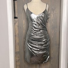 Silver Mini Party Dress, New With Tags, Back Zipper, Adjustable Straps, Hand Wash Only, 95% Polyester, 5% Spandex With Lining Ruched Dress For Holiday Party, Stretch Dresses For Summer Holiday Party, Forever 21 Sleeveless Ruched Mini Dress, Forever 21 Mini Dress For Cocktail Party, Forever 21 Cocktail Mini Dress For Party Season, Forever 21 Flirty Evening Dress, Forever 21 Sleeveless Party Dress, Forever 21 Fitted Party Dress, Forever 21 Mini Bodycon Dress For Party