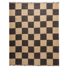 a black and white checkered rug with fringes