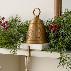 Christmas chimes meet stockings hung with care: A hand-engraved metal bell tops a creamy white marble slab to secure stockings above a fireplace or hang from any styled surface. Pairs beautifully with our Etched Brass Pillar Holders and Gigi Etched Brass Bells. Stocking Mantle Holders, Mantle Stocking Holders, Wood Advent Calendar, Stocking Holders For Mantle, Mcgee And Co, Embroidered Stockings, Antique Bell, Wooden Memory Box, Pillar Holders